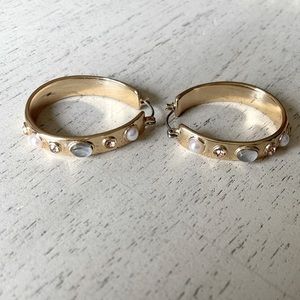 Pair of gold tone earrings